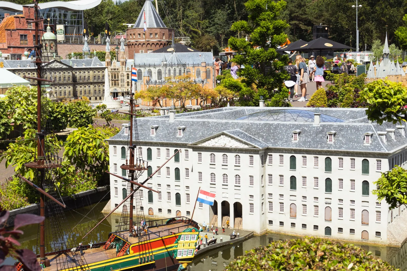 Madurodam park models with vintage aircraft behind the landmark buildings